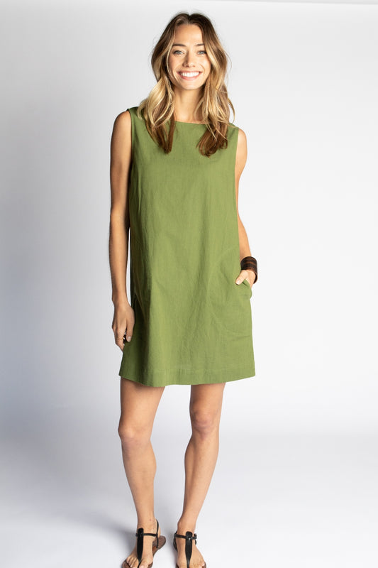 Model wearing Moss green Ghost Tropic sleeveless sustainable organic cotton Foster mini dress with round neck and pockets
